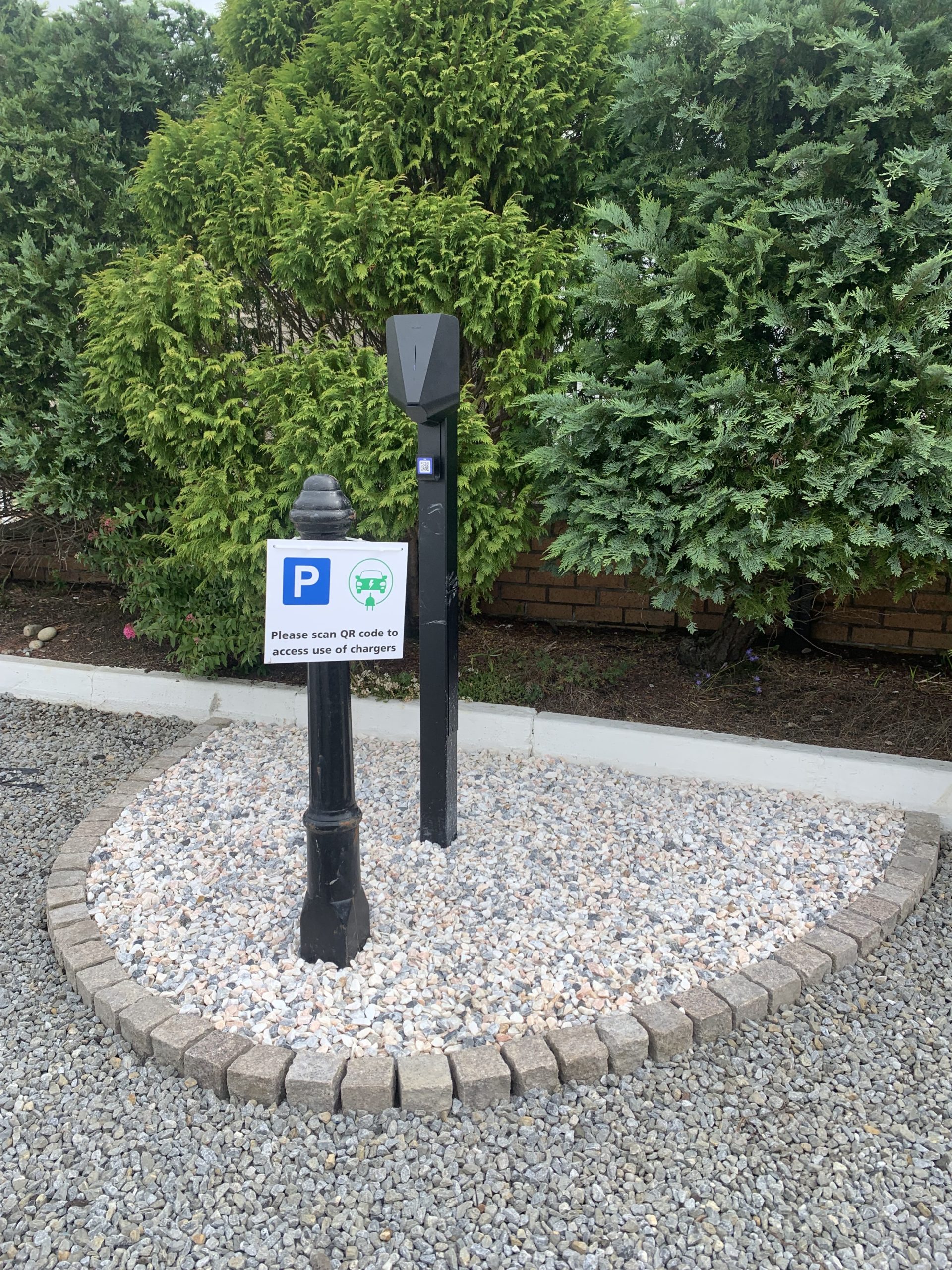 Electric vehicle charging point in red deer village